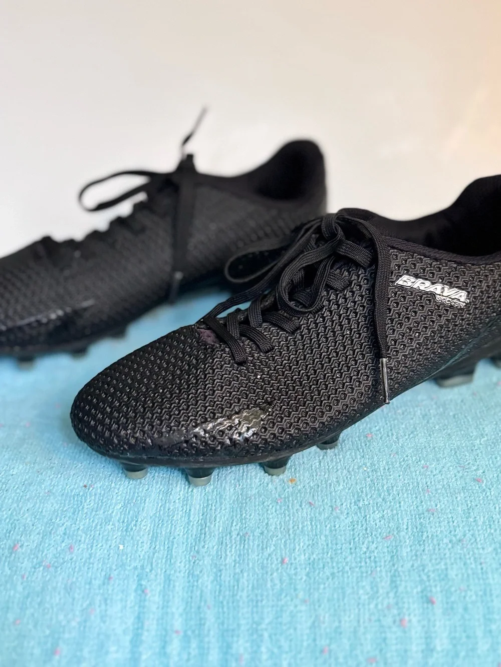 Black Brava Soccer cleats with textured knit pattern youth 4. #soccer #football